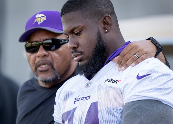 Vikings defensive line coach Andre Patterson spoke with Jaleel Johnson during a July training camp practice.