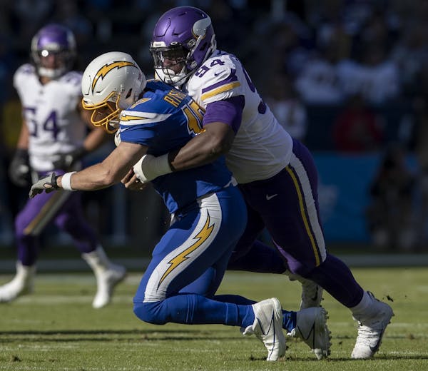 Minnesota Vikings' Jaleel Johnson (94) sacked Los Angeles Chargers quarterback Philip Rivers in 2019.
