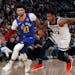 Denver guard Jamal Murray drove past Wolves defender Treveon Graham during the second half Friday.