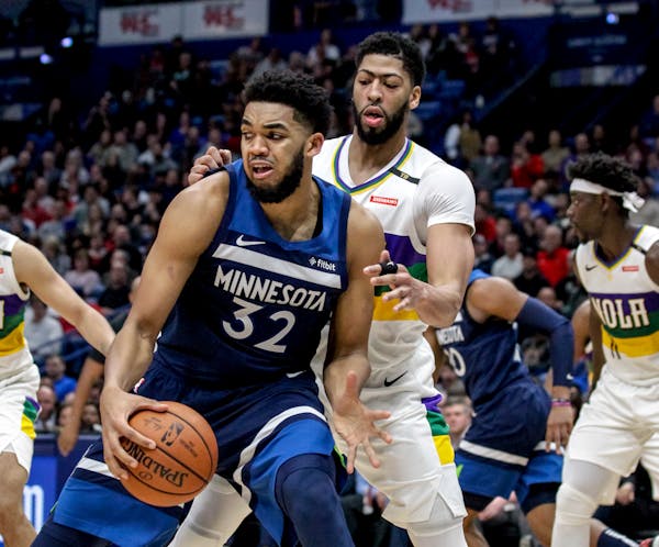 “AD is a better athlete. Karl is a better shooter,” Timberwolves assistant coach Kevin Hanson said of Anthony Davis, right, and Karl-Anthony Towns