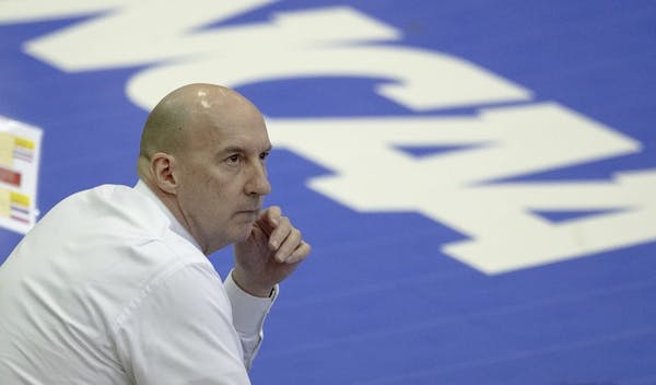 Gophers coach Hugh McCutcheon watched a replay during a match against Louisville in the fourth round of the NCAA volleyball tournament.