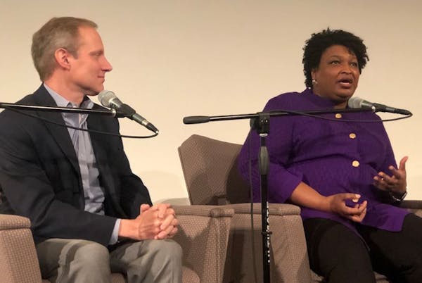Democrat Stacey Abrams talked about voter suppression with Minnesota Secretary of State Steve Simon during a panel discussion on voting rights Saturda