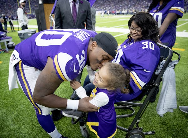 Vikings fullback C.J. Ham’s honored his mother during halftime against the Lions on Dec. 8 at U.S. Bank Stadium. He gave daughter Skylar, 3, a kiss.