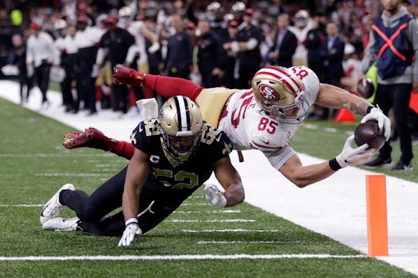 San Francisco 49ers tight end George Kittle dives to the pylon for a touchdown against New Orleans last month.