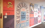 A wall in the new Kurt Vonnegut Museum and Library in Indianapolis displays vintage paperback covers of “Slaughterhouse-Five.”