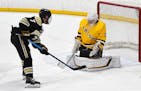 A close-range shot by Andover's Luke Kron is stopped by Rosemount goaltender Will Tollefson during Thursday's game at the St. Louis Park Rec Center. P