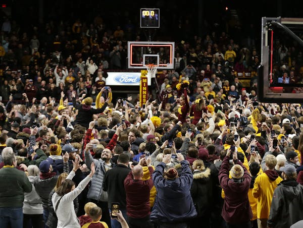 Gophers fans stormed the Williams Arena court after an upset victory over Ohio State on Dec. 15, but only 9,854 were on hand.