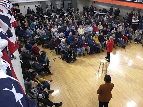 Democratic presidential candidate Elizabeth Warren campaigning in Iowa. During an event in a middle-school gymnasium, one woman’s question to the ca