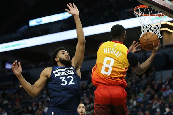 The Jazz's Emmanuel Mudiay drove past Timberwolves center Karl-Anthony Towns in a December game.