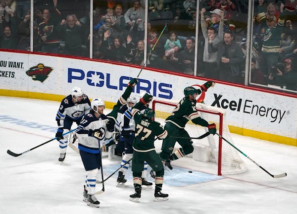 The Wild celebrated after center Eric Staal poked a loose puck into the net in overtime.