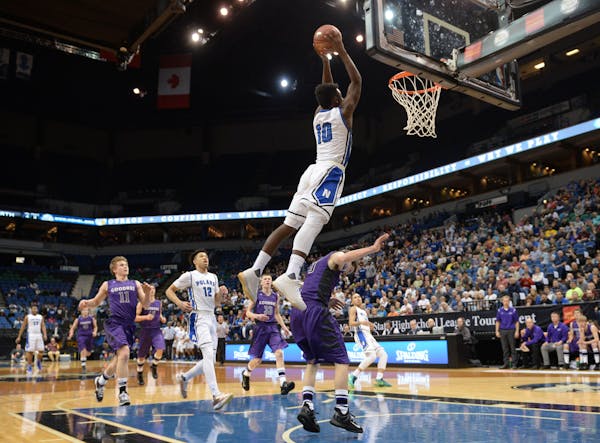 Then-Minneapolis North senior guard Tyler Johnson dunked the ball off an alley-oop pass in the first half of the 2016 Class 1A boys’ basketball cham