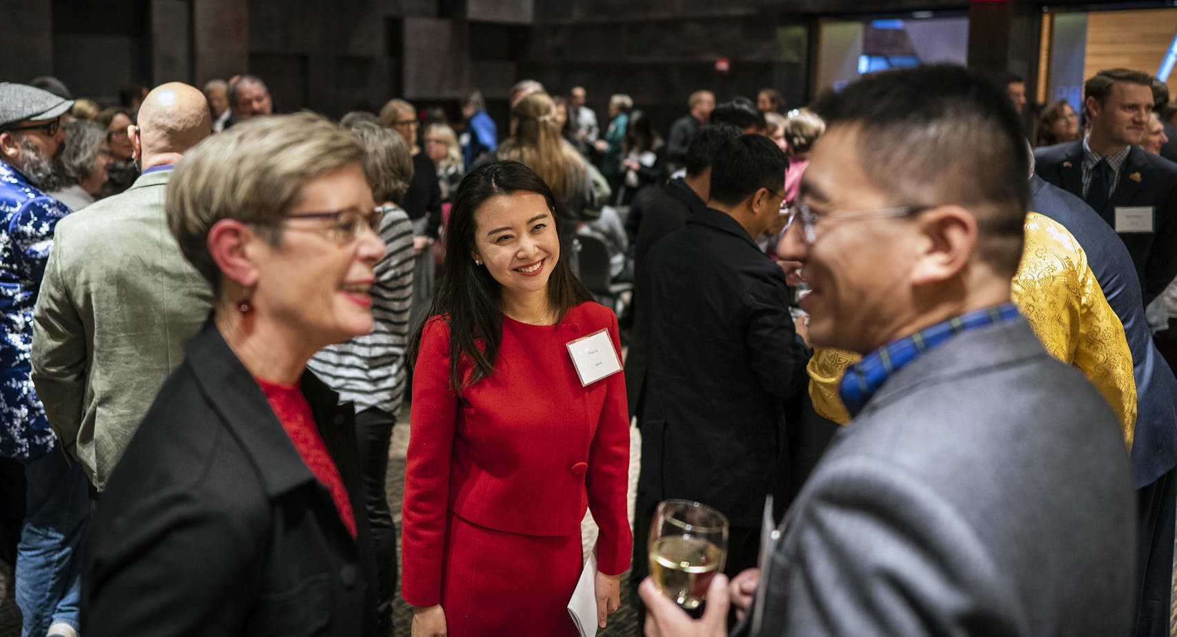 Fran Liu, center, the director of the University of Minnesota's China office in Beijing, talked with Meredith McQuaid, the Associate Vice President and Dean of International Programs for the U, left, and Tony Cui, right, a professor of marketing at the U, at a gala to mark the 40th anniversary of the U's China Center.