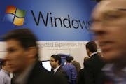 In this Jan. 11, 2010 file photo, a display for Microsoft's Windows 7 is shown at the National Retail Federation's convention in New York. Users still