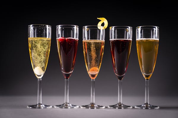 From left, Herbal Champagne Cocktail, Poinsettia, Classic Champagne Cocktail, Kir Royale and 50th & France.
