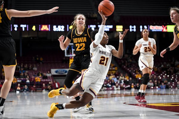 Gophers guard Jasmine Brunson attempted an off-balance shot after she was fouled by Iowa guard Kathleen Doyle in the first quarter.