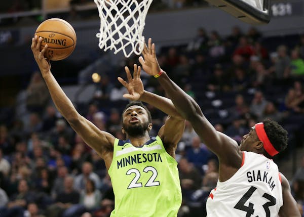 The Wolves’ Andrew Wiggins shot against Toronto’s Pascal Siakam during his triple-double: 18 points, 10 rebounds, 11 assists.