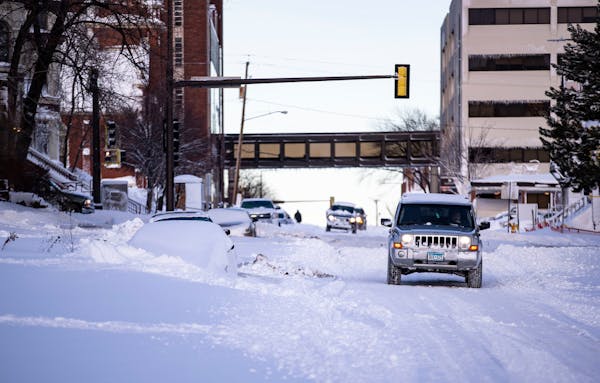 A Jeep made its way down a snow-covered road in Duluth in December.