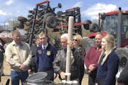 Vice President Mike Pence, center, visited a farm near Glyndon, Minn., in May 2019 to promote the revised U.S. free trade agreement with Canada and Me