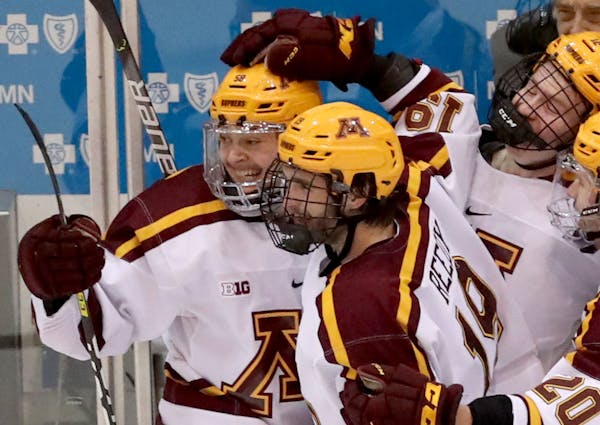 The Gophers’ Sampo Ranta, left celebrating one of his goals, is big, strong and starting to have more success as a sophomore.