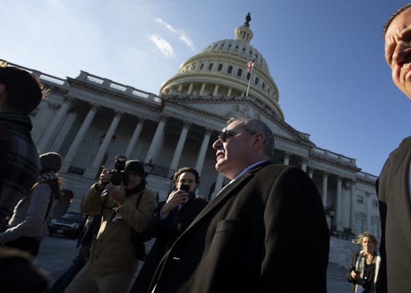 Lev Parnas, center, a Rudy Giuliani associate with ties to Ukraine, walks outside the Capitol in Washington, Wednesday, Jan. 29, 2020, during the impe