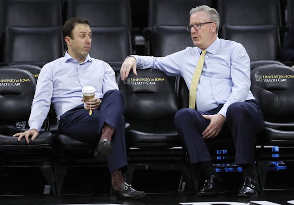 Gophers coach Richard Pitino, left, talked with Iowa coach Fran McCaffery before their teams met in Iowa City on Dec. 9. Their teams are a combined 1-