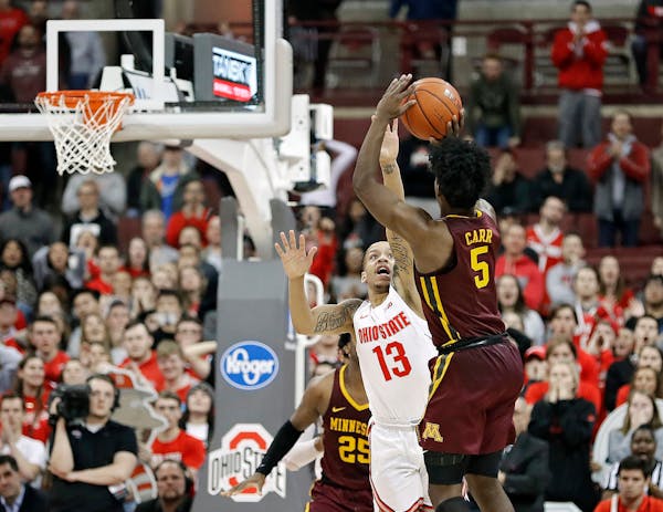 Minnesota's Marcus Carr hits the game-winning 3-pointer over Ohio State's C.J. Walker during the final seconds.