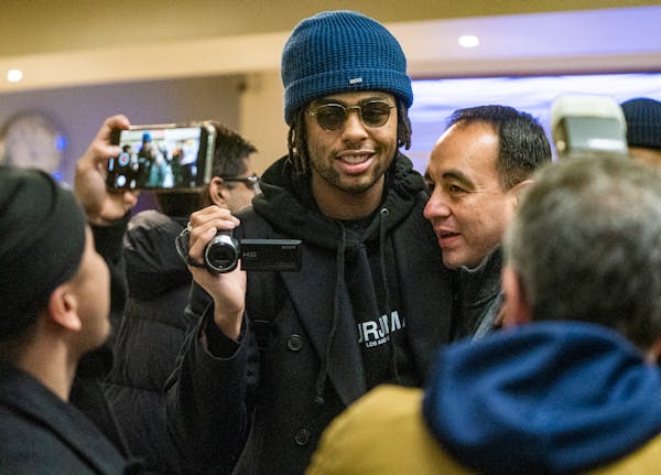 D'Angelo Russell, the newest Timberwolves player, arrived at the Signature wing of MSP airport. He was greeted by Timberwolves President Gersson Rosas