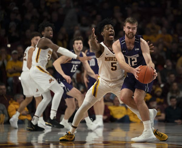 Gophers guard Marcus Carr ended up forcing a turnover by Northwestern guard Pat Spencer with his defense in the first half.