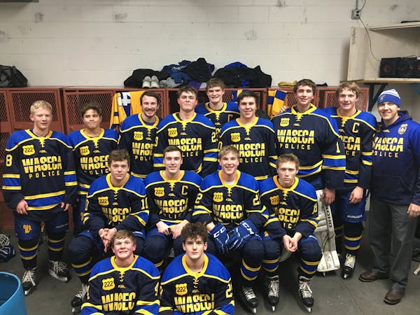 The Waseca Bluejays wearing jerseys honoring wounded police officer Arik Matson.