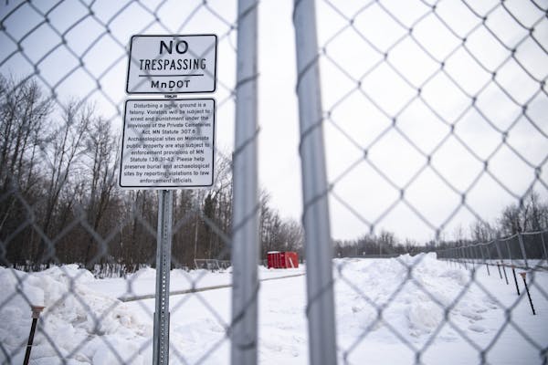 A fence and “No Trespassing” signs have been set up around a MnDOT worksite that disturbed a Native American burial ground in far western Duluth.