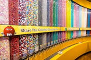 The Mall of America M&Ms store will include a two-story footprint of its “chocolate wall.” The company traces its history to Minneapolis.