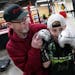 Mike Evgen explained technique to Soren Holdahl, 10, as they worked out with a punching bag.