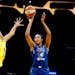 Napheesa Collier shoots while defended by Los Angeles Sparks' Candace Parker in September.