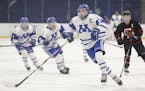 Defenseman Rory Guilday (5) of Minnetonka leads the Skippers, seeded No. 1 in Class 2A, Section. Photo by Jeff Lawler, SportsEngine