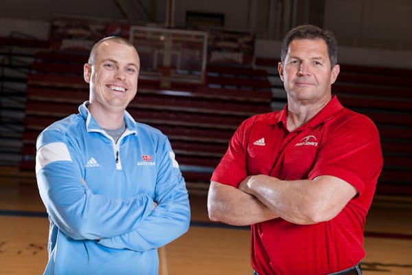 Gary Fasching (football) and Pat McKenzie (men's basketball) replaced legends at St. John's. They were photographed here in 2015.