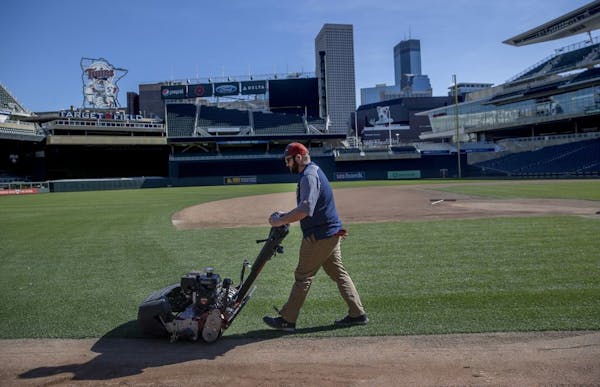 Ian Almquist, with the Minnesota Twins grounds crew, mowed the lawn at Target Field, Friday, March 6, 2020 in Minneapolis, MN.