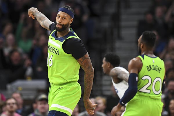 Newly acquired Wolves forward James Johnson reacted after scoring a basket in the second half Saturday night against the Clippers. Johnson had 15 poin