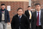 St. Paul City Council Member Dai Thao, left, walked with his attorney Joe Dixon, right, from the Ramsey County Law Enforcement Center following a 2018