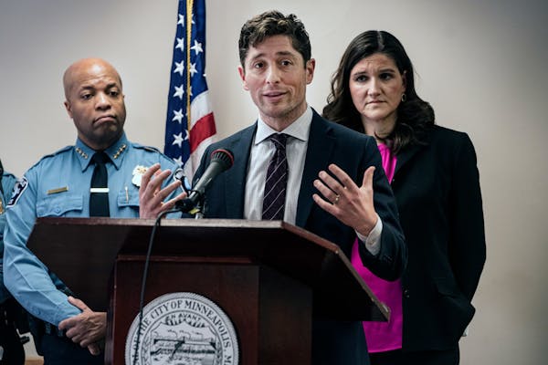 Minneapolis Mayor Jacob Frey addressed overhauling the department's off-duty employment program at a Wednesday news conference. Behind him were Police