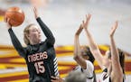 Farmington’s Paige Kindseth went up to the basket above Eden Prairie’s defense during the first half of their match up in the Class 4A girls' bask