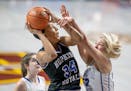 Hopkins’ Maya Nnaji was fouled by Cambridge-Isanti’s Jana Swanson during the first half of their match up in the Class 4A girls' basketball quarte