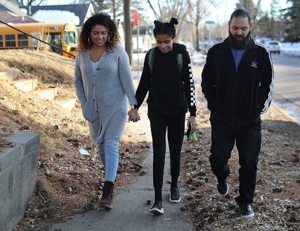 Stephanie Gasca, left, — seen with her daughter Kennedy and her fiancé, Jimmy Patino — is skeptical the plan to plan to radically reshape Minneap