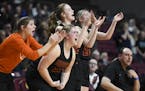 The Henning bench cheered during a victory over Fillmore Central in the Class 1A girls' basketball quarterfinals. It was the Hornets’ last game.