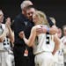 Fillmore Central head coach Levi Olstad embred guard Kassidy Broadwater (5) after Broadwater left the game late in the second half as Henning held on 