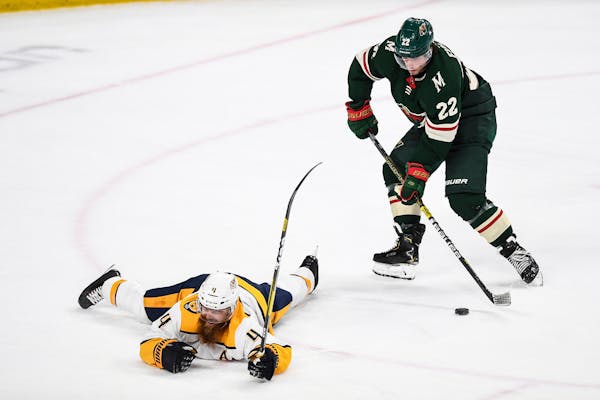 Wild left wing Kevin Fiala (22) scored after faking out Nashville defenseman Ryan Ellis (4) during the first period.