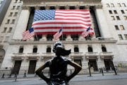 The Fearless Girl statue stands in front of the New York Stock Exchange, Monday, March 16, 2020 in New York.
