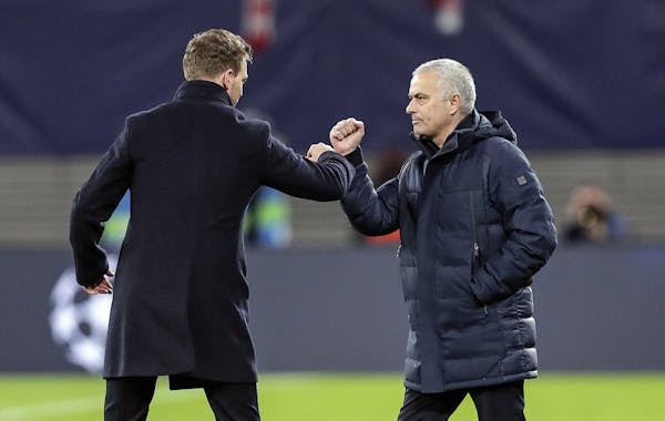 No more handshakes: at a soccer match in Germany earlier this week, Tottenham's manager Jose Mourinho, right, and Leipzig's head coach Julian Nagelsma