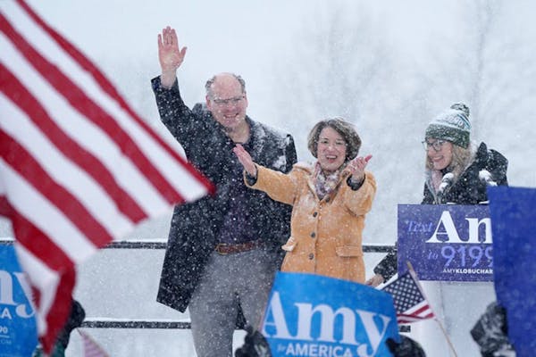 Husband John Bessler and daughter Abigail stood at Sen. Amy Klobuchar's side as she announced her presidential bid.