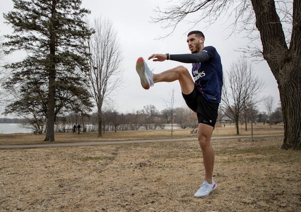 Minnesota United FC defender Michael Boxall stretched out before a run around Bde Maka Ska earlier this week.