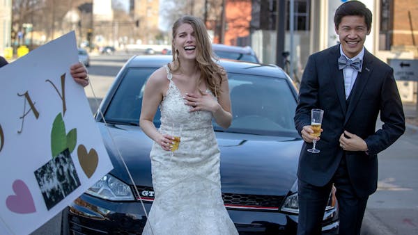 Watch a drive-by wedding reception prompted by COVID-19